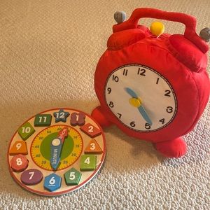 IKEA Hermmahos a giant alarm clock plush with wooden time puzzle.